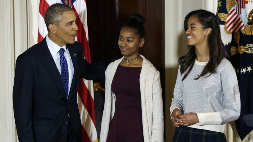 O presidente americano, Barack Obama, ao lado das filhas Sasha (E) e Malia: "eu tenho que confessar que minhas filhas geralmente exercem impacto em mim"